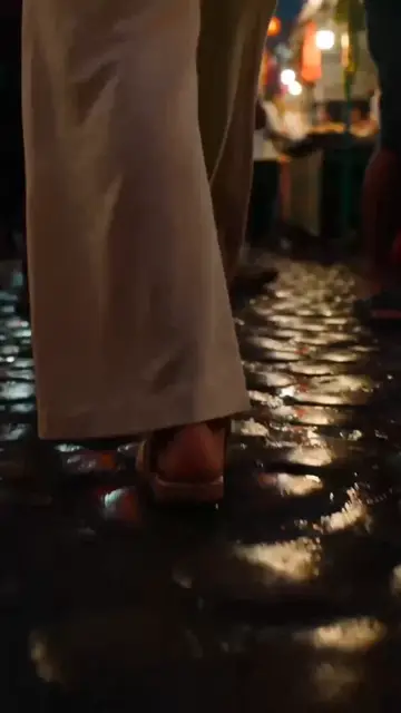 Southeast Asian Night Market Ground-to-Aerial POV