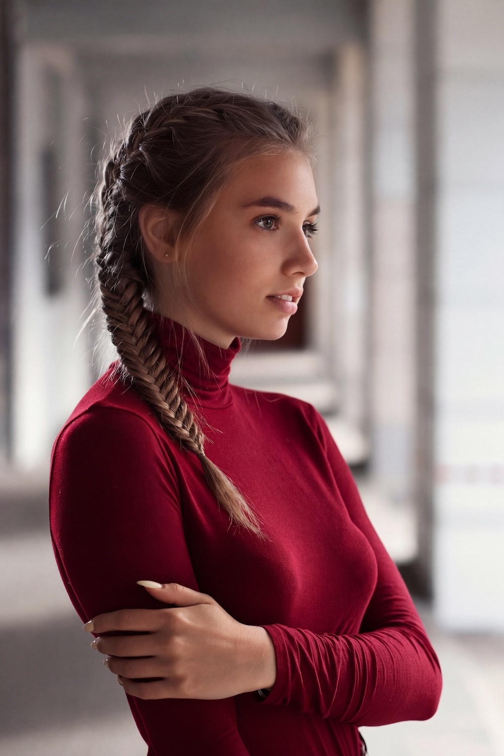 The same woman with the top changed to red by an AI outfit changer